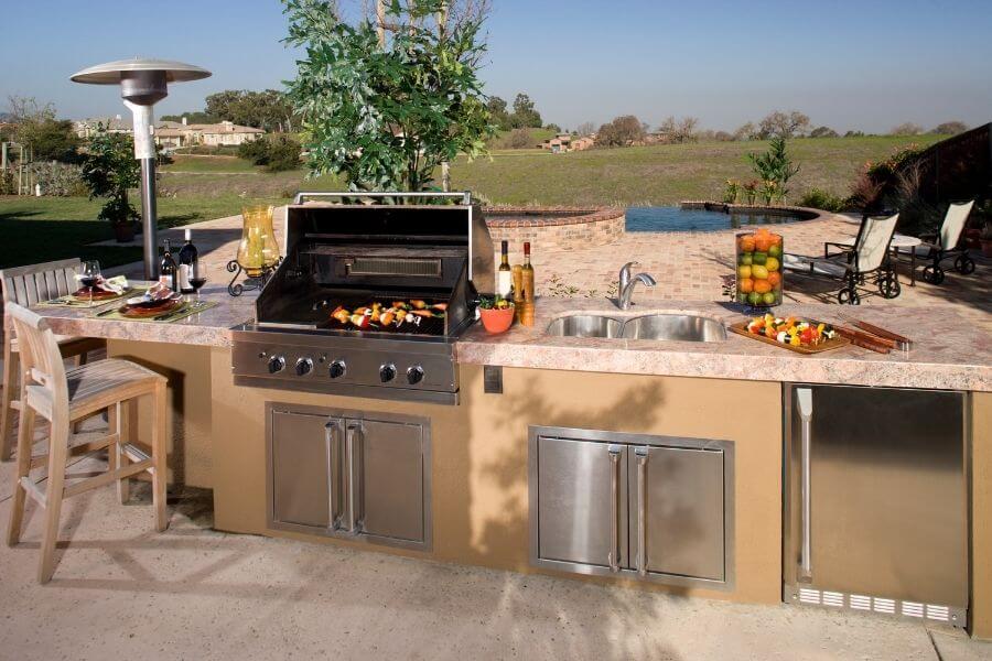 a pool outdoor kitchen with a bar counter